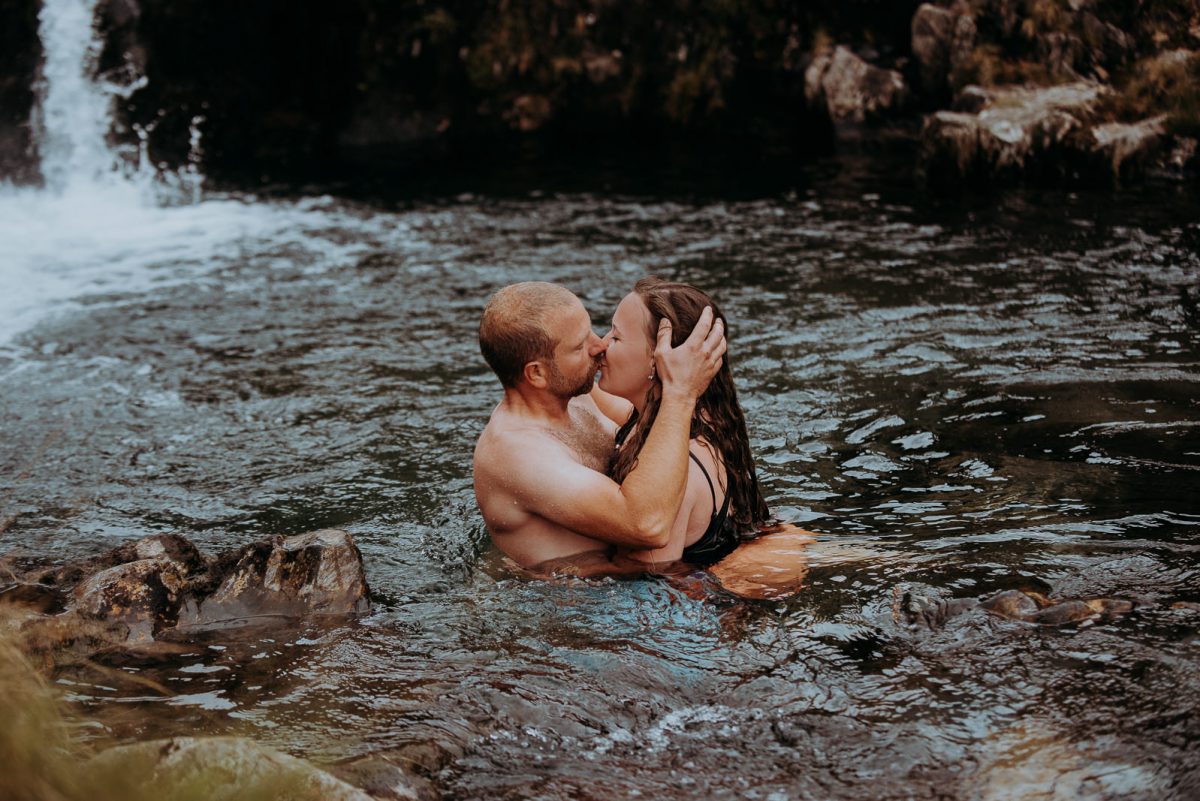 Couple swimming in a natural pool in the UK.