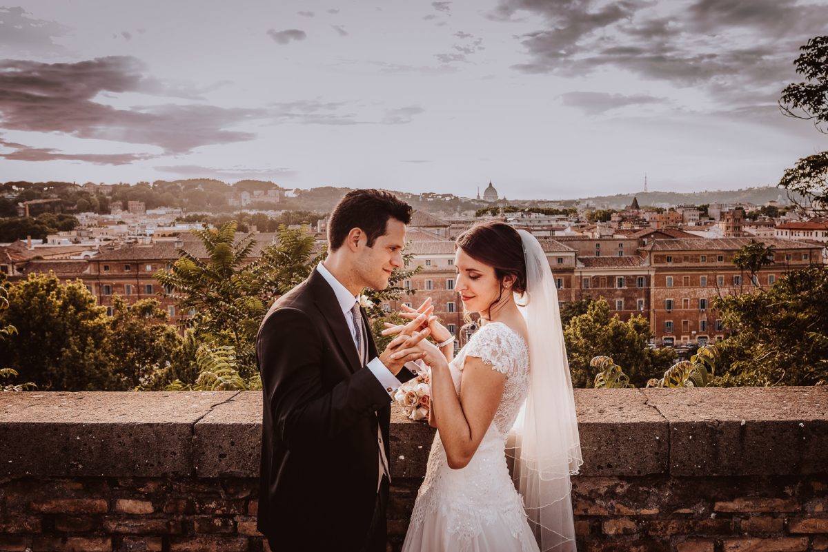 Elopement in Rome. Couple enjoying the view of Rome seen from the top at sunset.
