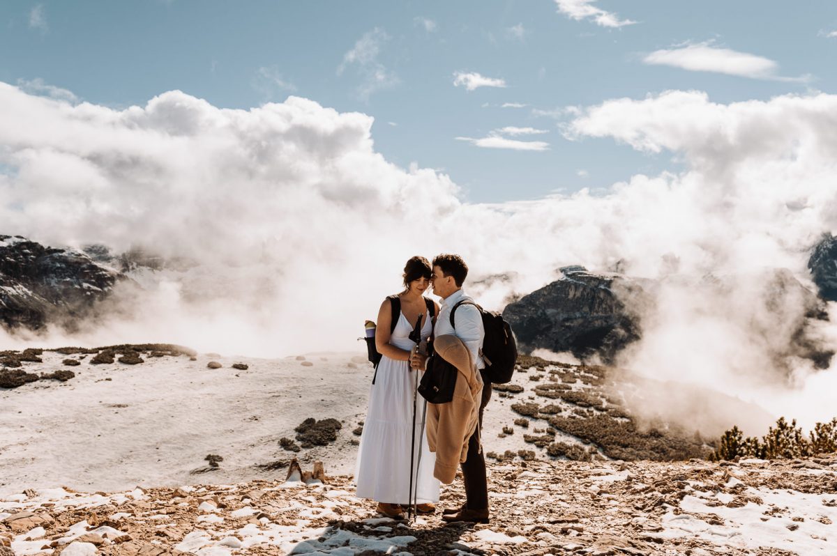 Couple kissing on the top of the mountain