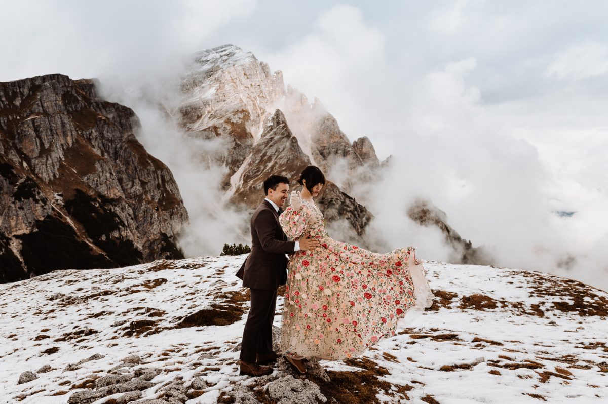 Couple standing in front of the mountain