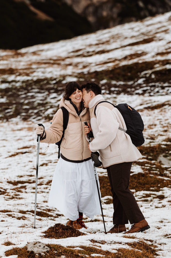 Couple hiking and kissing